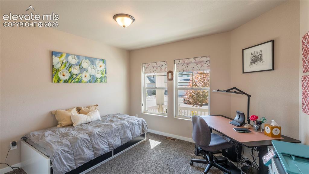 Image 15 of 32: Bedroom with study area
