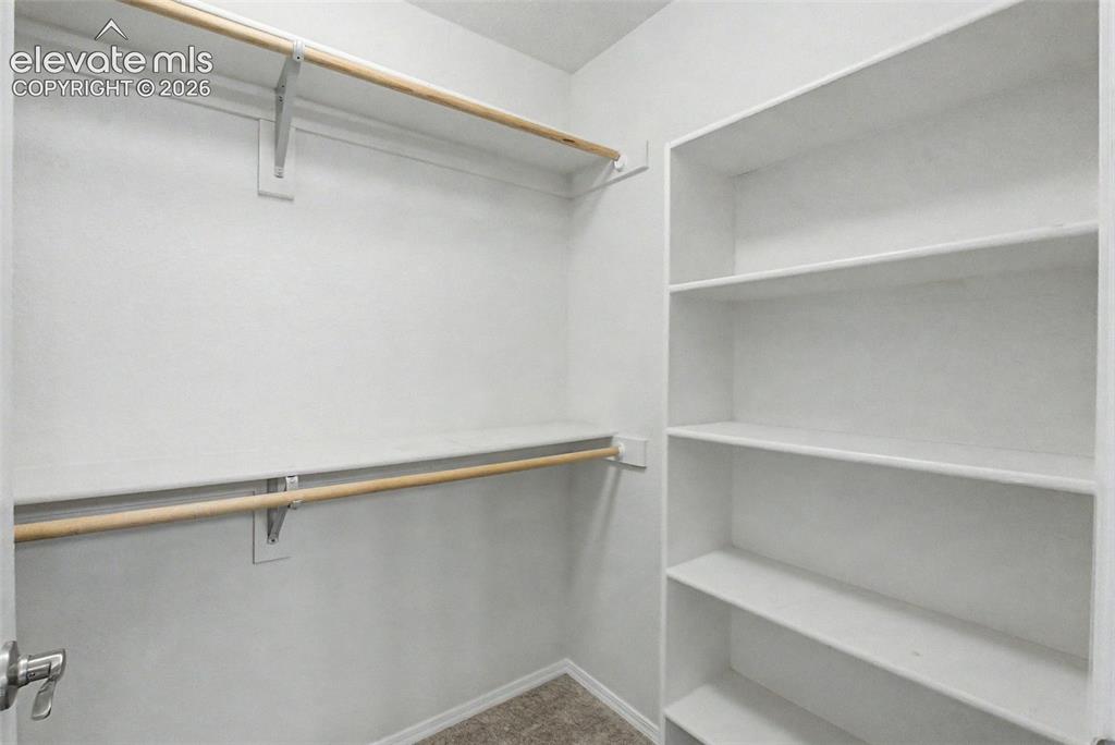 Image 19 of 30: Master walk in closet