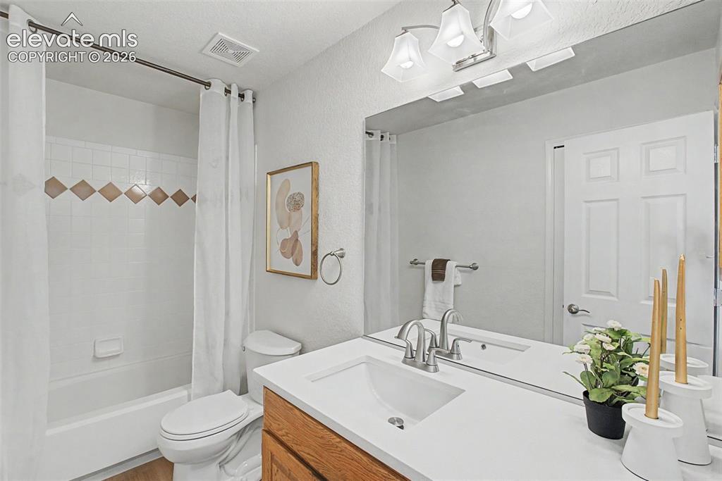 Image 26 of 30: Main level full bathroom