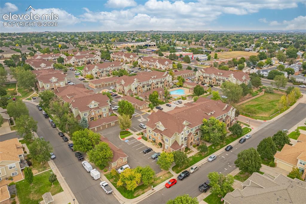 Image 25 of 27: Expansive residential community with multiple multi-story buildings, dedica