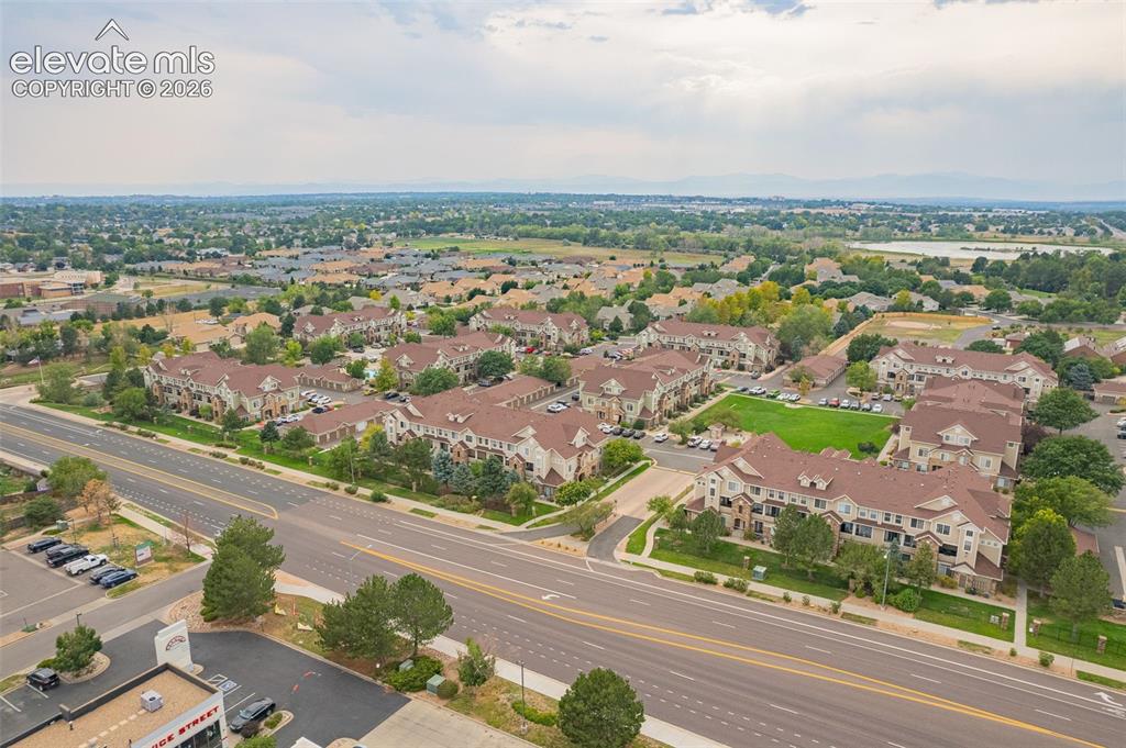 Image 27 of 27: Aerial perspective of a developed community featuring multi-story residence