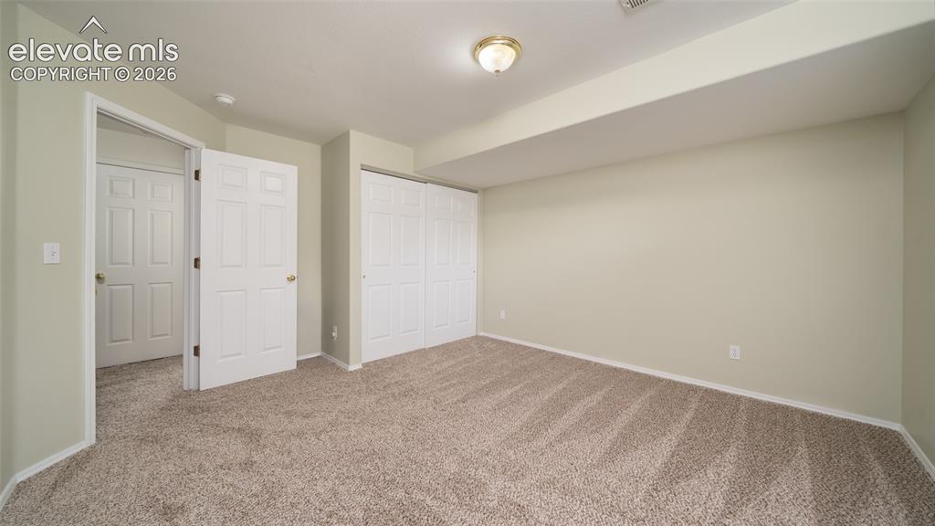 Image 24 of 32: Basement bedroom