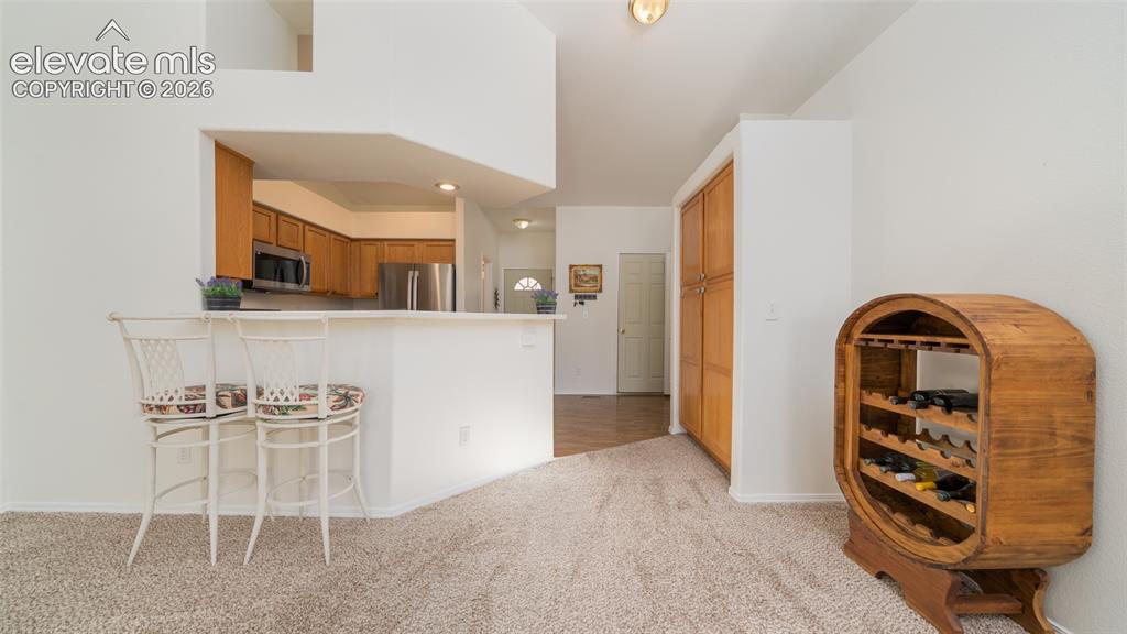 Image 9 of 32: Dining and kitchen
