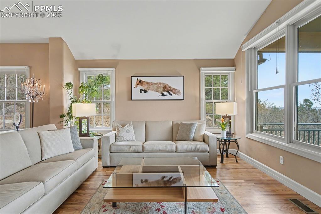 Image 16 of 45: Tranquil mountain and city views filter through newly installed window trea