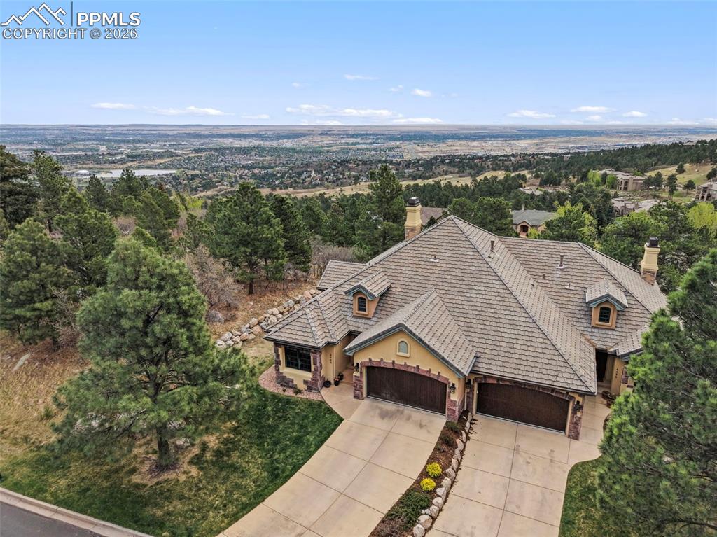 Image 2 of 45: Positioned perfectly on Cheyenne Mountain, the property enjoys sweeping cit