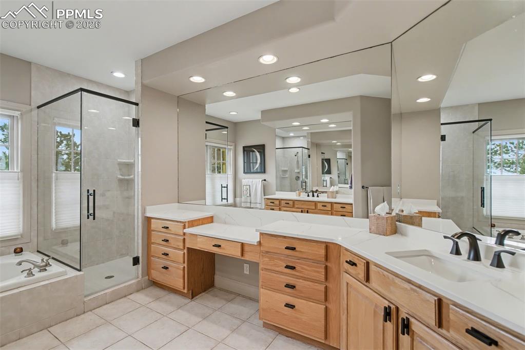 Image 23 of 45: The five-piece primary bath rivals any high-end spa, featuring an expansive