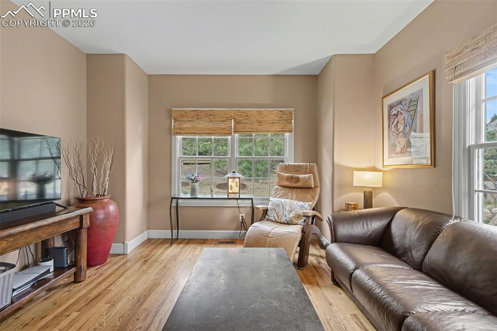 Image 26 of 45: A dedicated main-level office provides a quiet, sunlit retreat ideal for wo