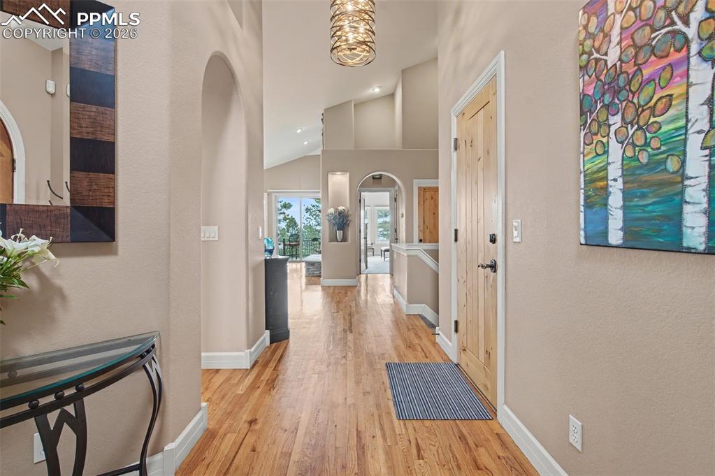 Image 3 of 45: Impeccable details, like the natural wood doors and elegant lighting, set a