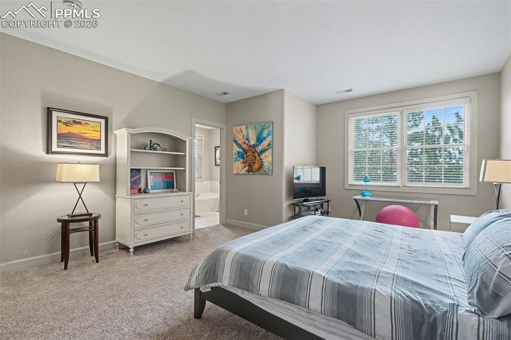 Image 30 of 45: Bright and inviting, this large guest room boasts beautiful views, proving 