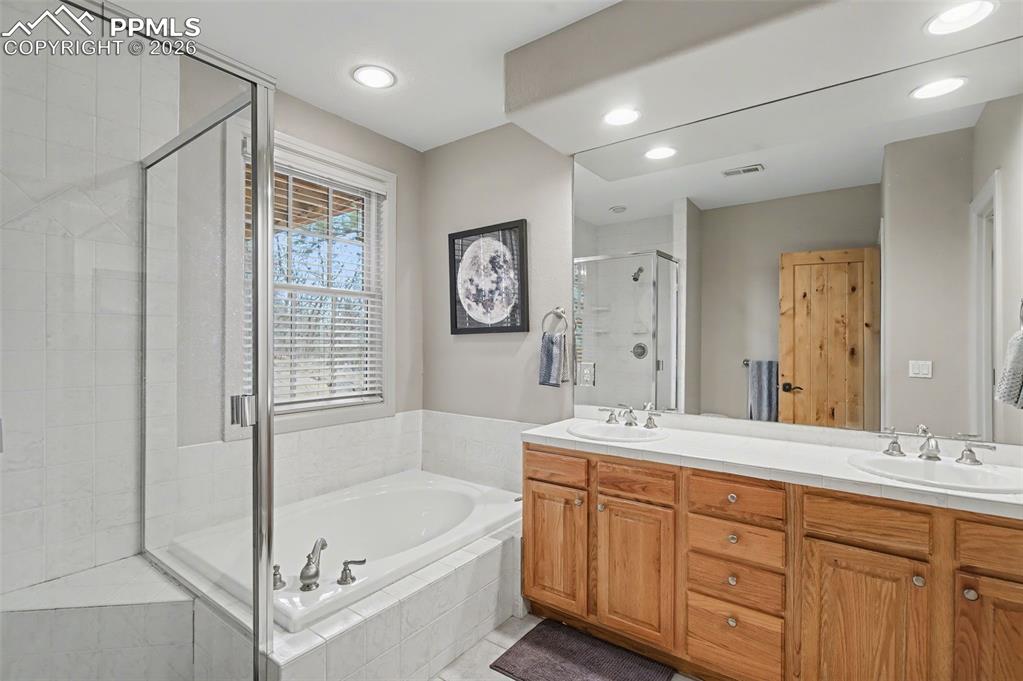 Image 31 of 45: Guests will appreciate the impeccably maintained lower-level full bath, fea