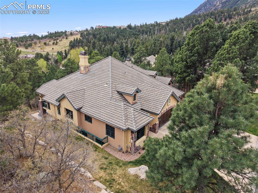 Image 43 of 45: Backing onto peaceful open space, the home guarantees exceptional privacy a