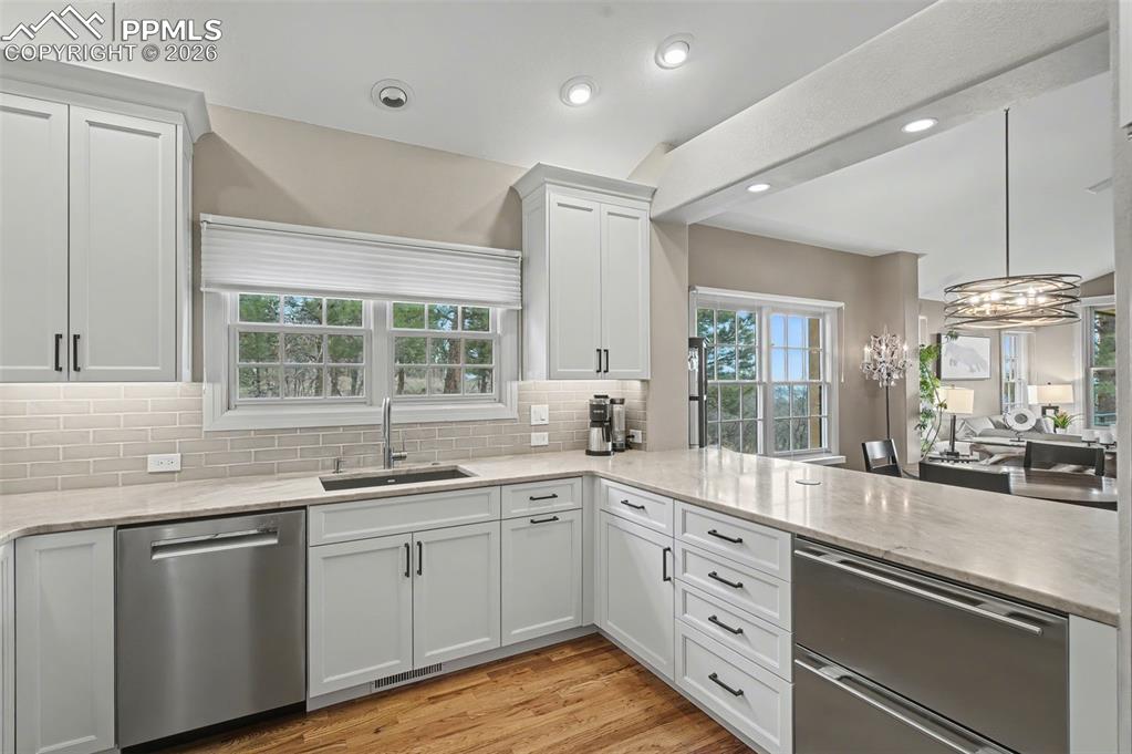 Image 8 of 45: A spacious breakfast bar serves as the perfect casual dining spot or a soph