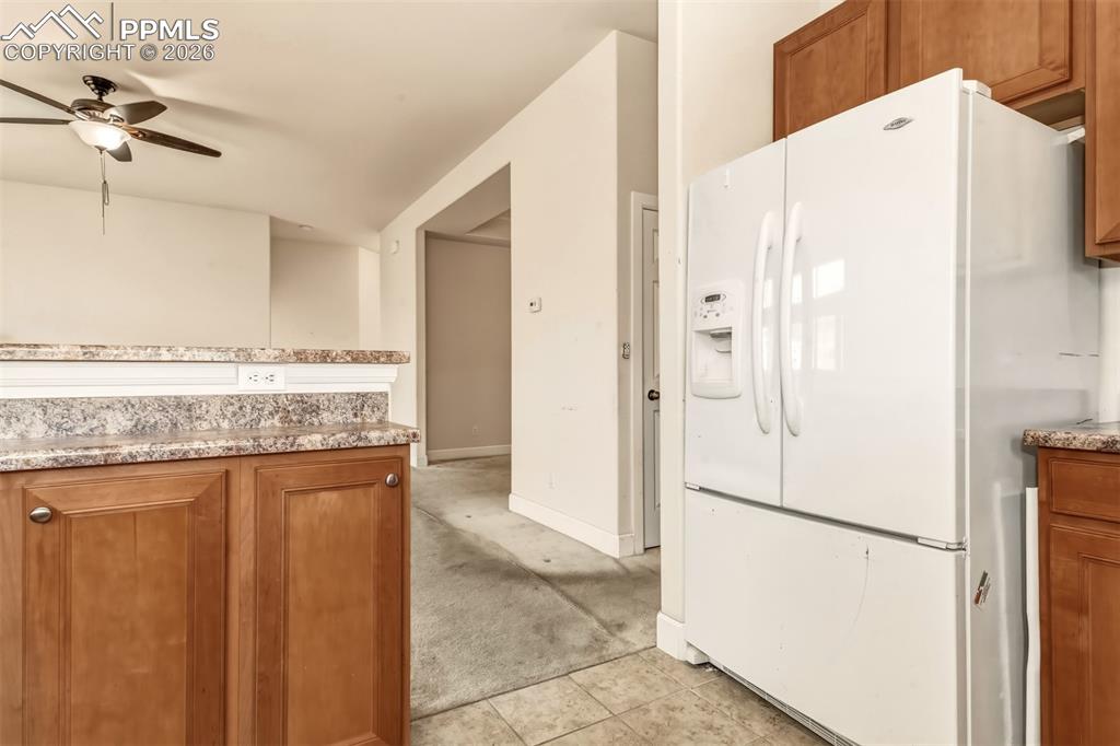 Image 10 of 34: Kitchen looking to living room