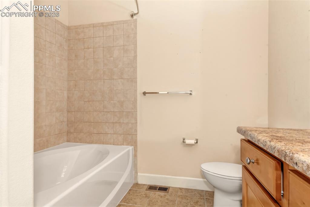 Image 18 of 34: Full bathroom with connection from bedroom 2 and the living room