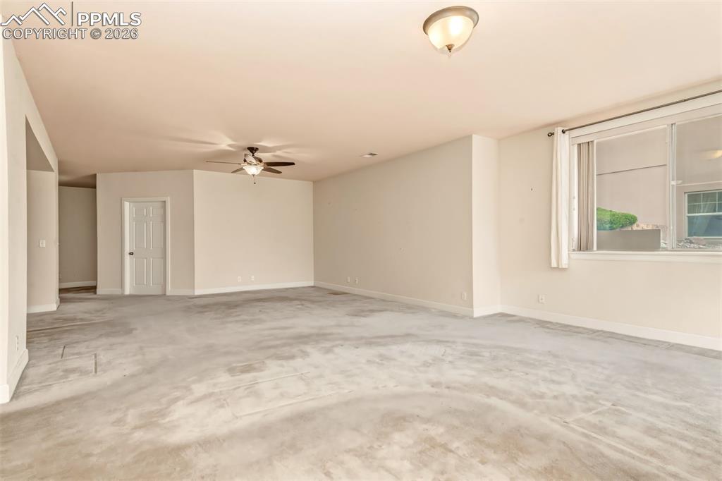 Image 20 of 34: Recreation room on lower level with walk out to covered patio