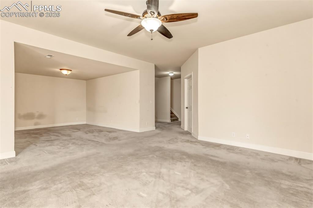 Image 26 of 34: Recreation room on lower level with walk out to covered patio