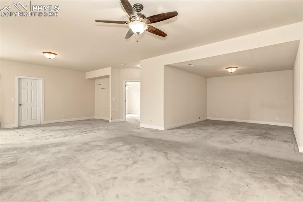 Image 27 of 34: Recreation room on lower level with walk out to covered patio