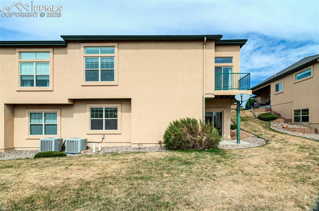 Image 28 of 34: Back view of the townhome