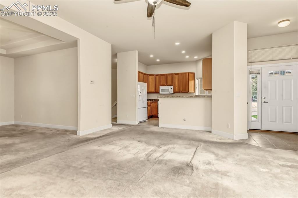 Image 4 of 34: Spacious living room with plenty of natural light 