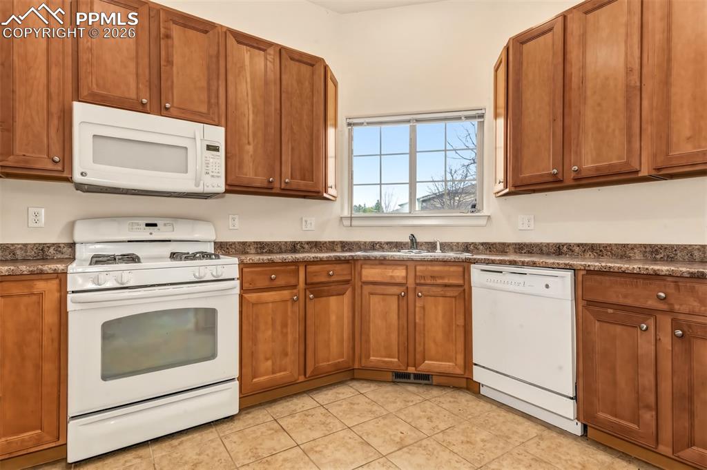 Image 9 of 34: Kitchen with ample cabinet space and matching appliances