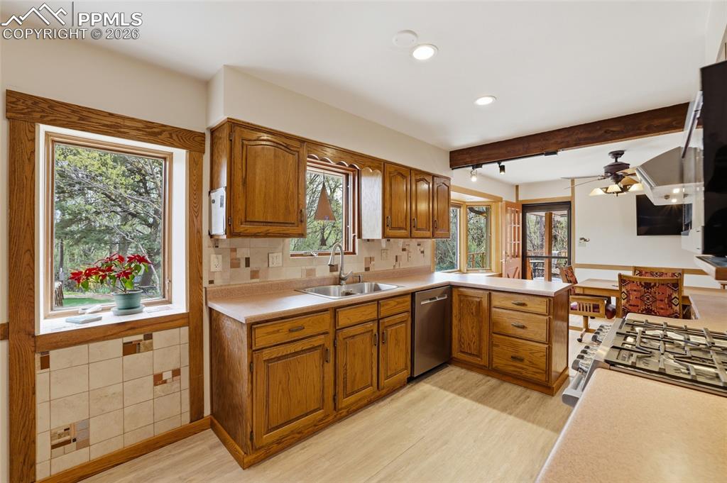 Image 11 of 50: Fun mid-century built-in at left and large bay window at right