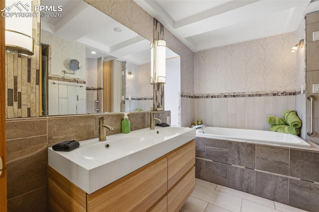 Image 17 of 50: View of primary bedroom from sitting area