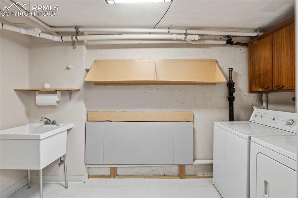 Image 28 of 50: Family room at basement with built-ins and gas fireplace