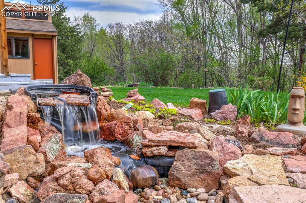 Image 41 of 50: Covered patio and composite deck with door to dining room at left