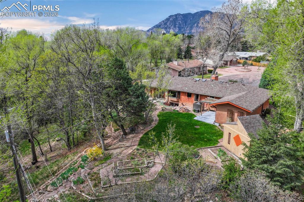 Image 44 of 50: Water feature and view of garden shed at left
