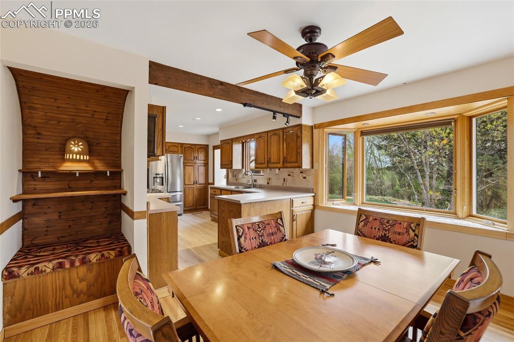 Image 8 of 50: View of LR with front door at left and kitchen at right