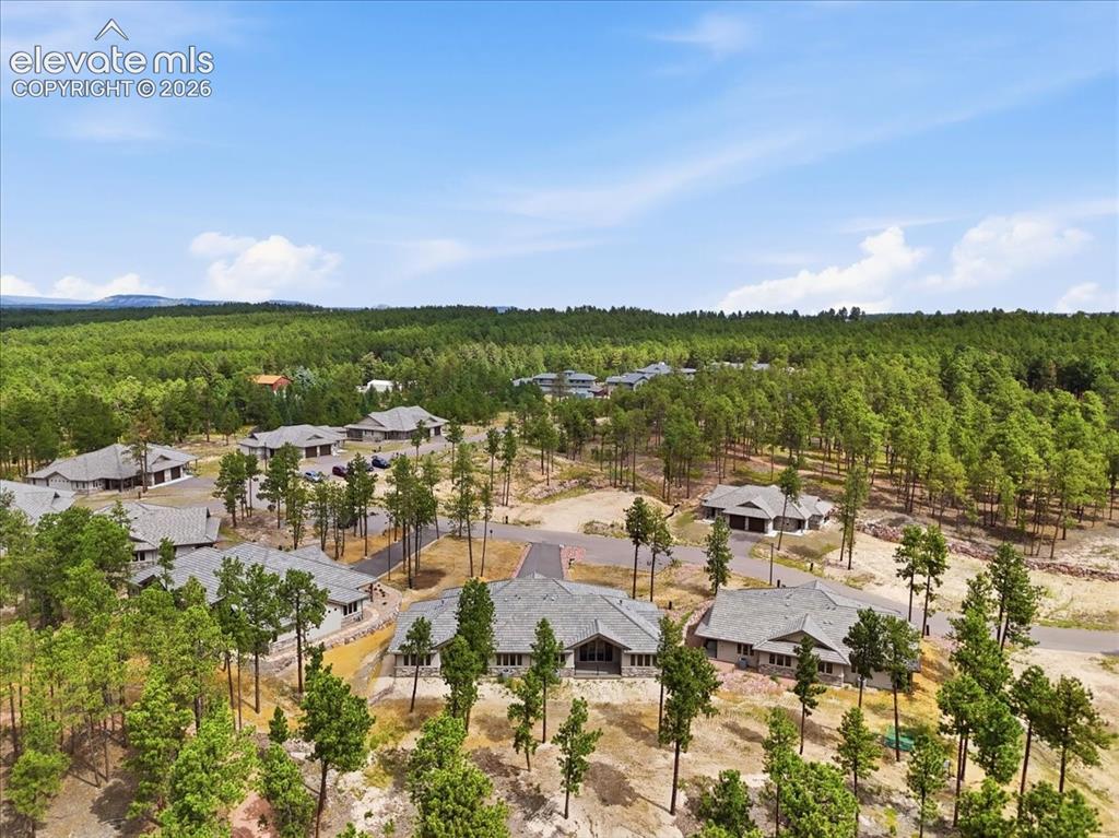 Image 12 of 18: Enjoy wooded seclusion in this small community.