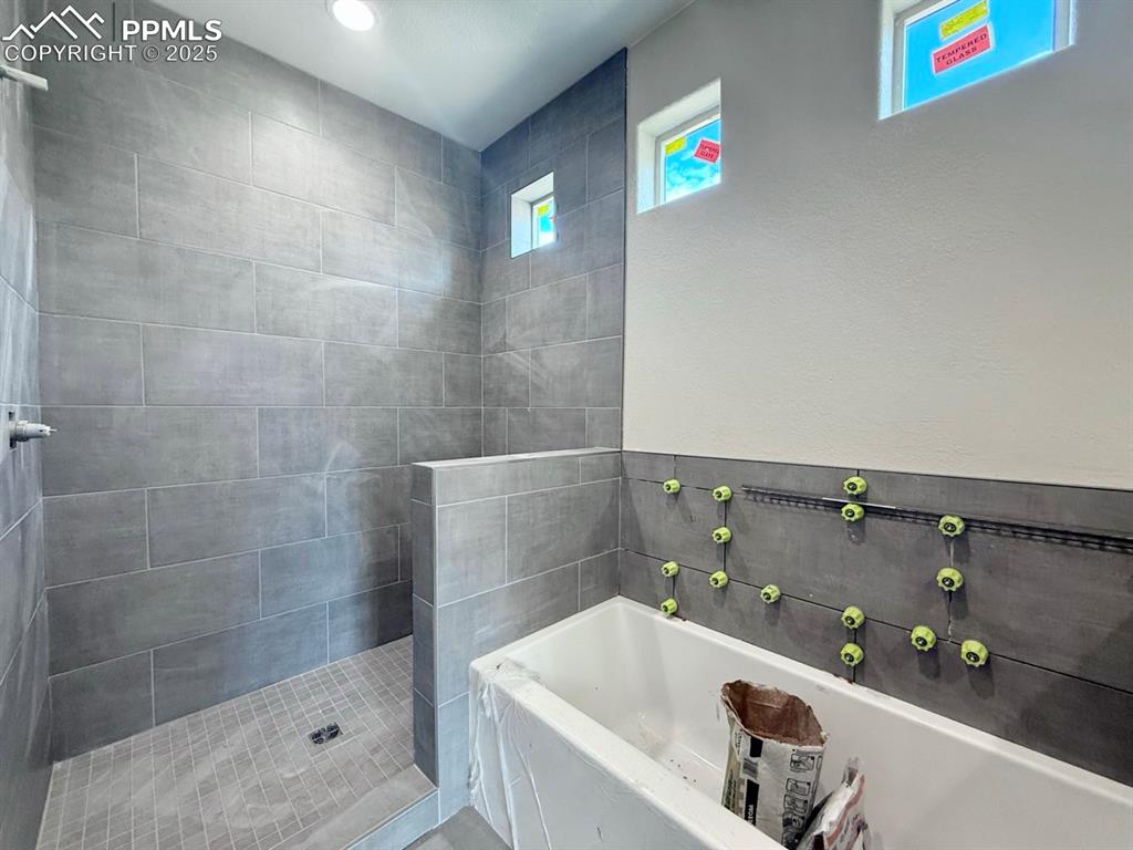 Image 17 of 23: Separate Tub and Shower, Double Vanities