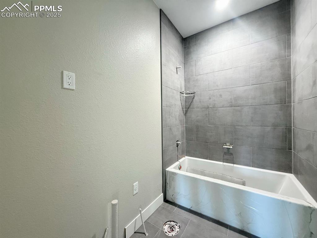 Image 6 of 23: Full Bathroom, Tiled Flooring, Quartz Countertop