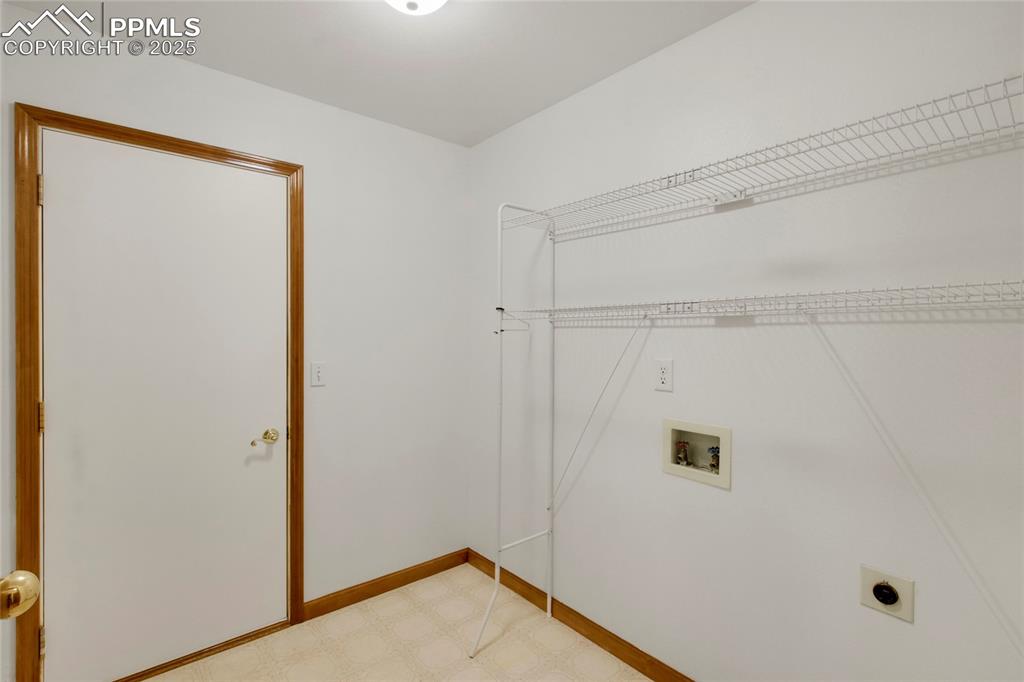 Image 10 of 27: Laundry area featuring washer and electric dryer hookups