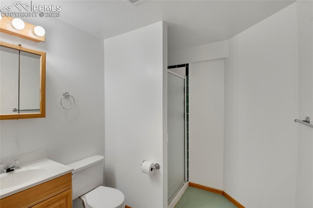 Image 21 of 27: 3/4 bath featuring vanity and a walk in shower