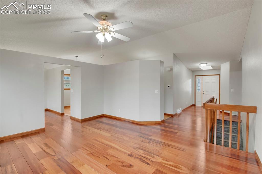 Image 4 of 27: Living room with fan