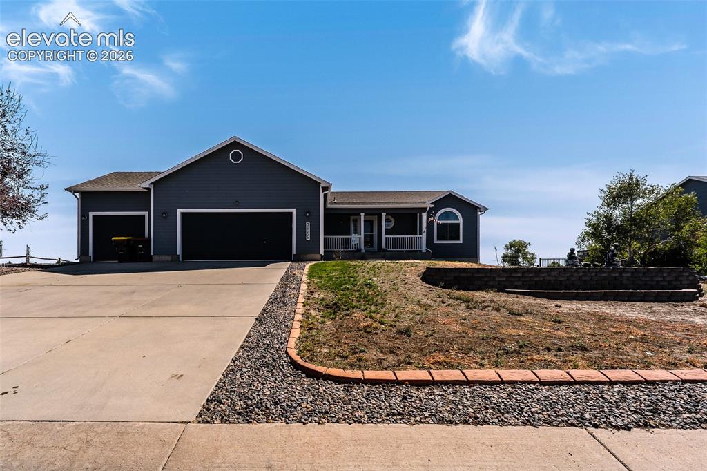 Image 13 of 50: Beautifully maintained ranch style home with 3-car garage and covered front