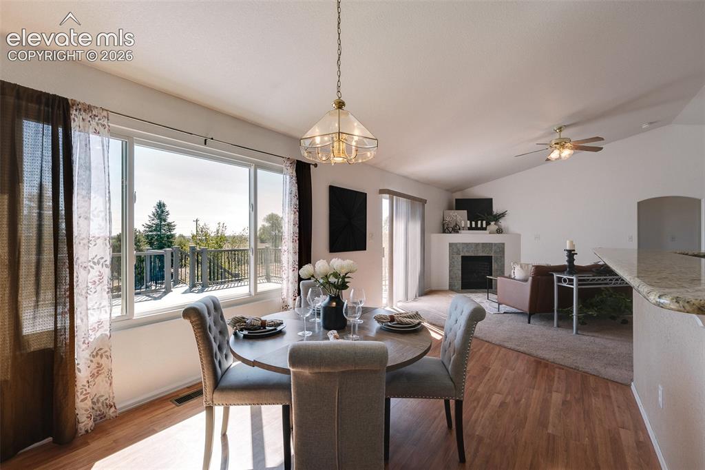 Image 16 of 50: This inviting dining area is bathed in natural light and opens effortlessly