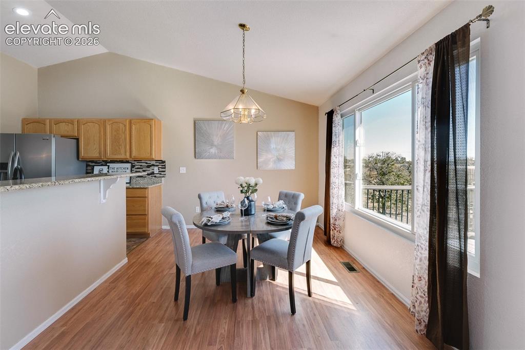 Image 17 of 50: This dining area offers scenic views, abundant natural light, and plenty of