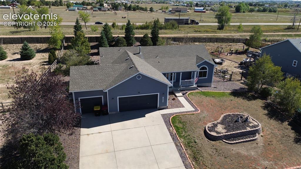 Image 2 of 50: Aerial view of home and lot.