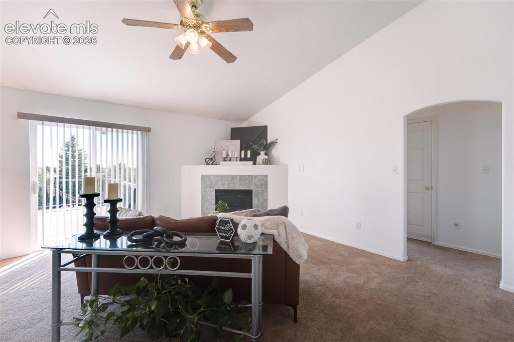 Image 20 of 50: Walk Out Living Room with arch way into the main level Bedrooms.