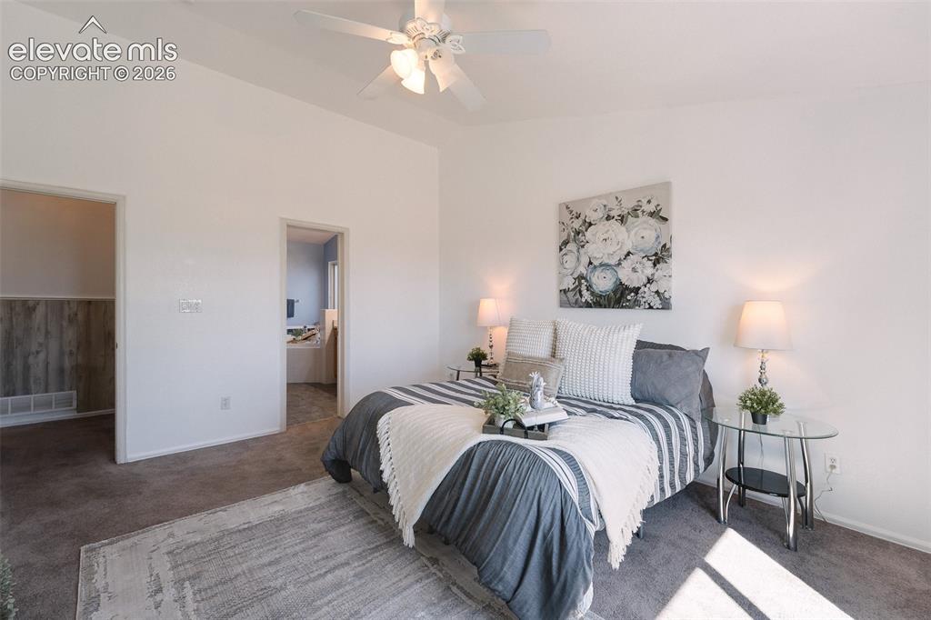 Image 22 of 50: The Primary Bedroom has an adjoining Bathroom and walk in closet.
