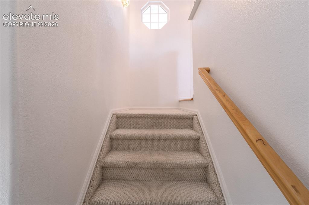 Image 29 of 50: Stairs to the Finished Basement.