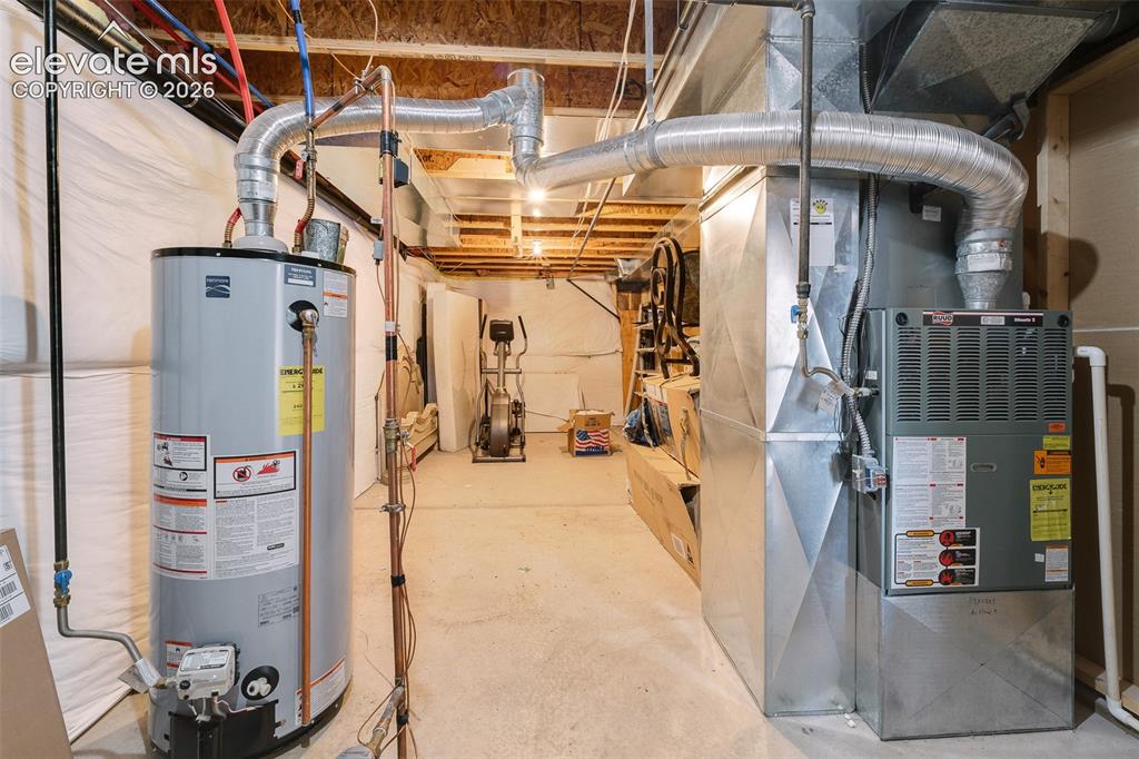 Image 38 of 50: Large utility room with space for additional storage.