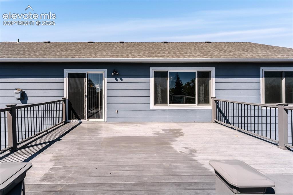 Image 42 of 50: Backyard composite deck for outdoor dining and entertaining.
