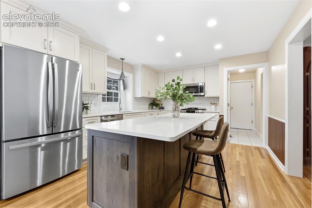 Image 15 of 50: Stainless GE Profile appliances, soft close cupboards and drawers...