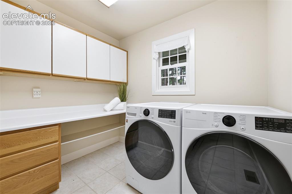 Image 18 of 50: Main level laundry with washer and dryer
