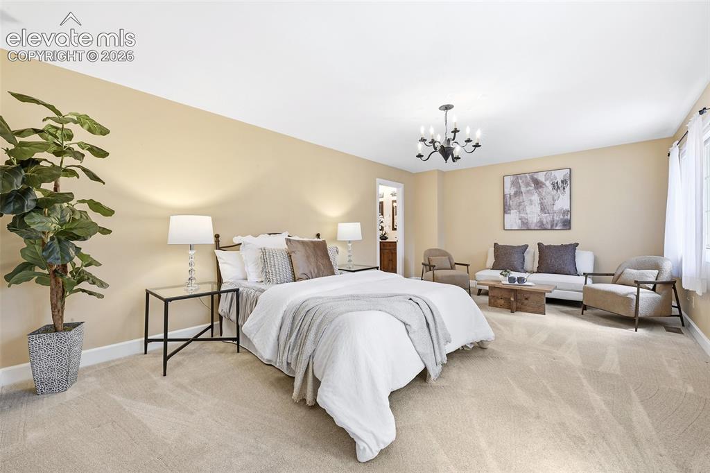 Image 19 of 50: Spacious Primary Bedroom with seating area...