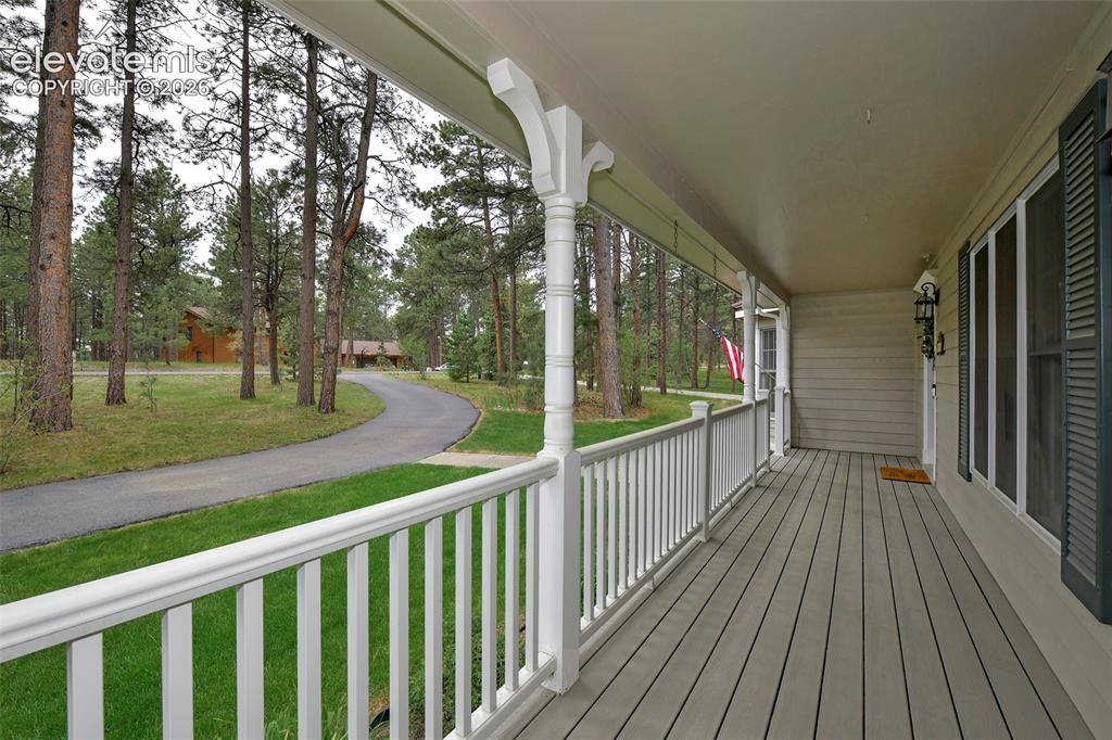 Image 3 of 50: Circular driveway for convenience and long front Trex porch!