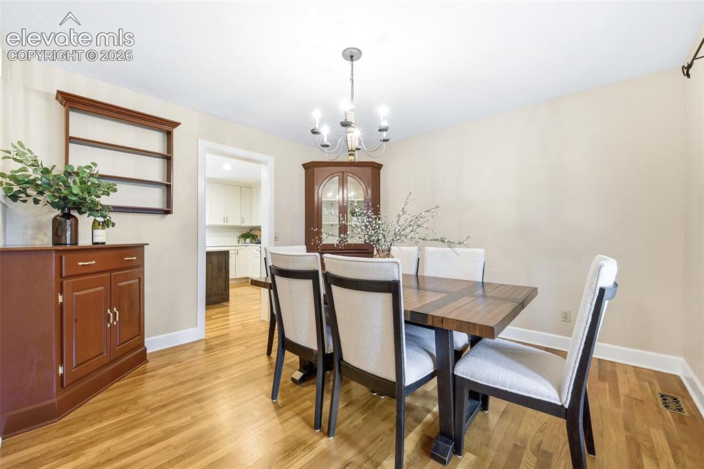 Image 4 of 50: To the right, a formal dining room with built-ins!